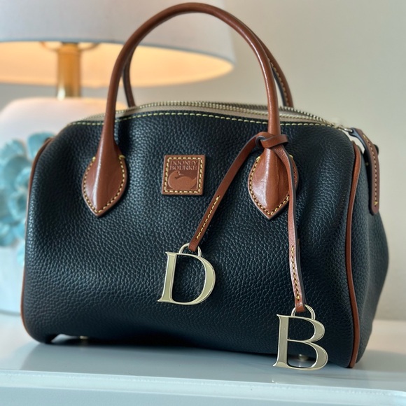 Dooney and Bourke black and tan purse. - Picture 1 of 4
